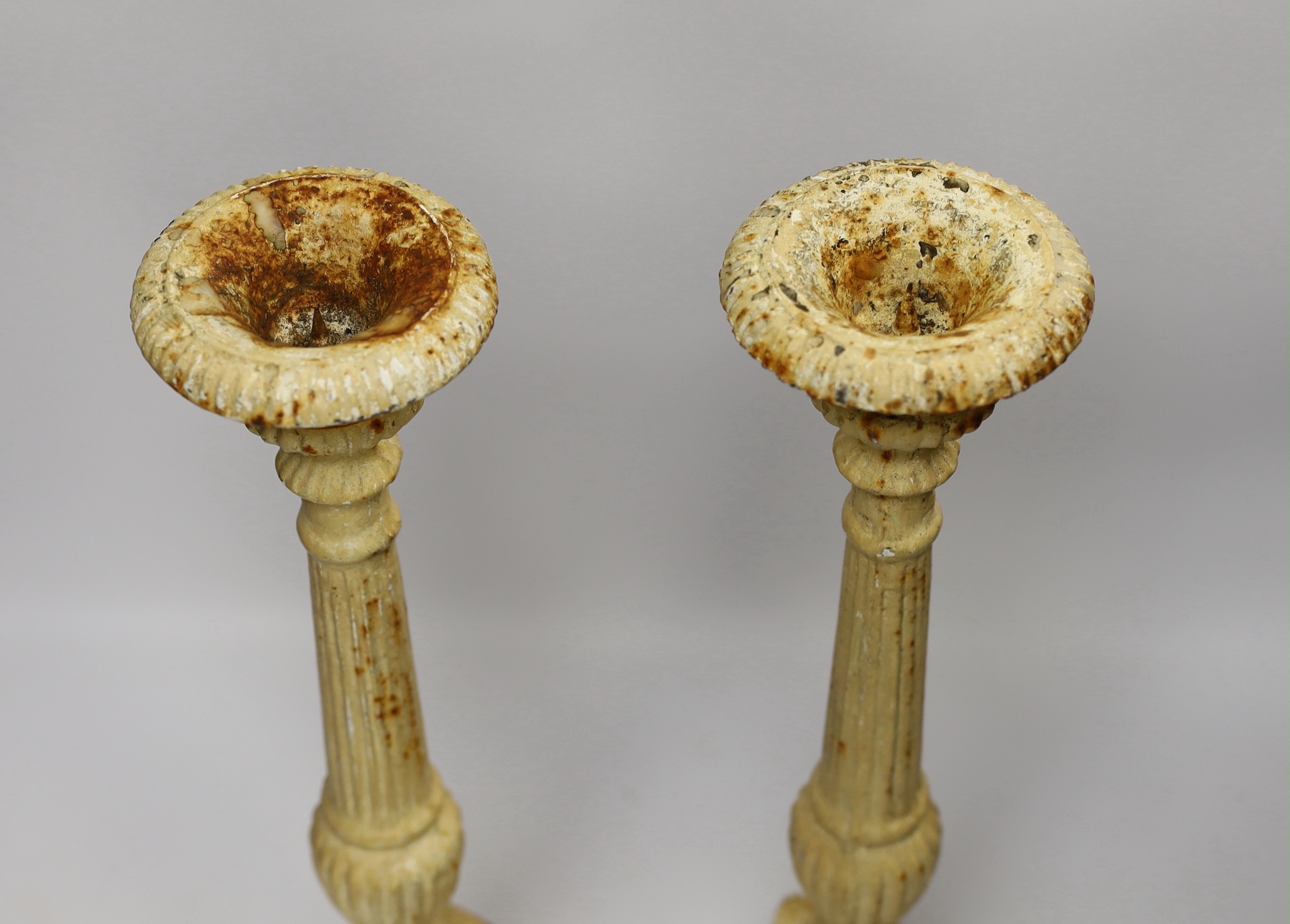 A pair of period-style cast iron candlesticks, 43cm